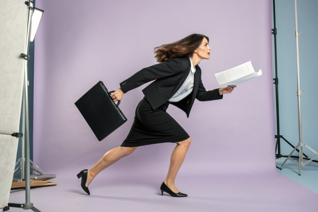 beautiful lawyer woman in motion carrying urgent l